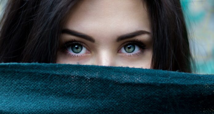 Photo by Alexandru Zdrobău a close up of a person with blue eyes