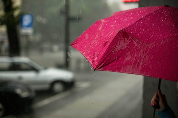Photo by Erik Witsoe pink umbrella