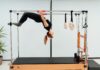 필라테스, 건강한 몸과 마음을 위한 최고의 선택 a woman doing a handstand on a pivot machine